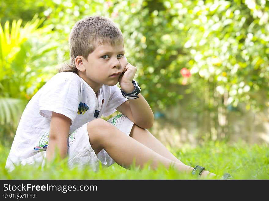 Portrait of little boy having good time in summer environment. Portrait of little boy having good time in summer environment