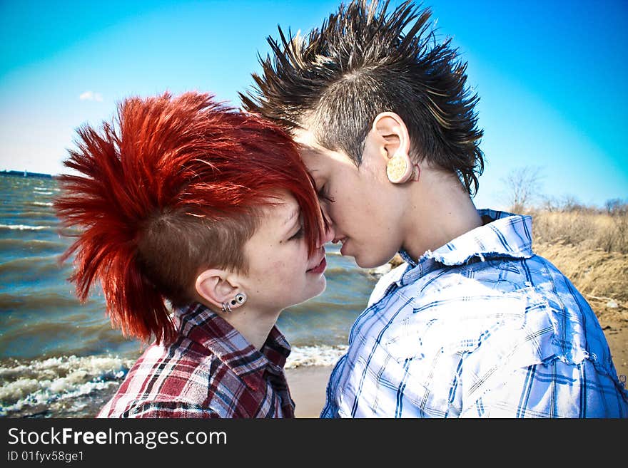 Two young women sharing an intimate moment on the beach