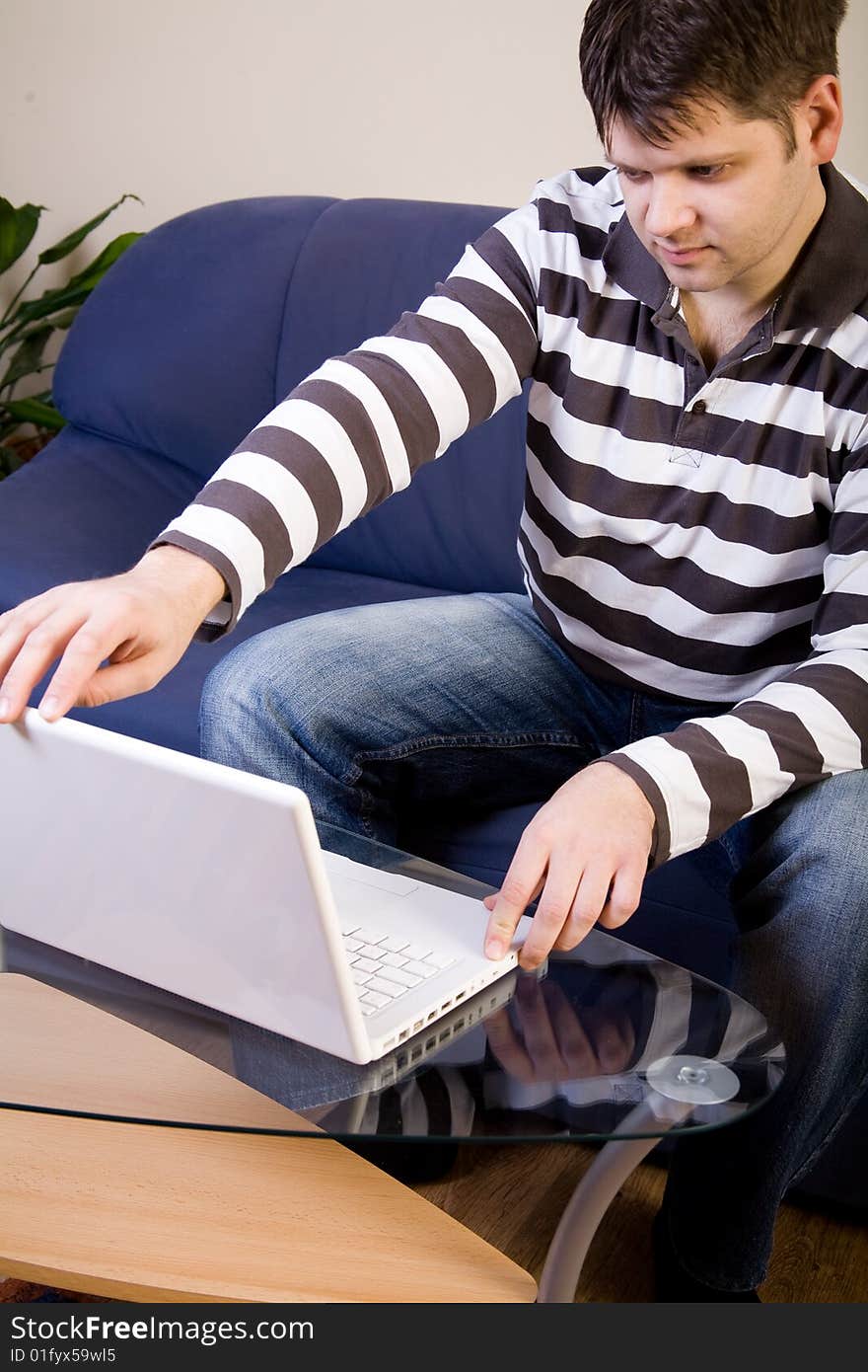 Young man work with computer at home