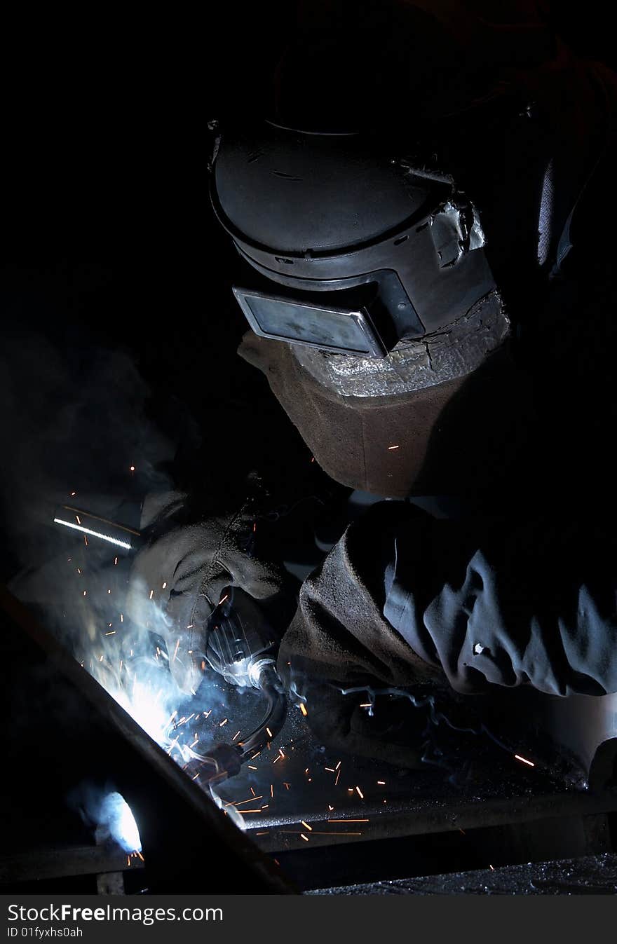 A picture of a welder hard at work. A picture of a welder hard at work