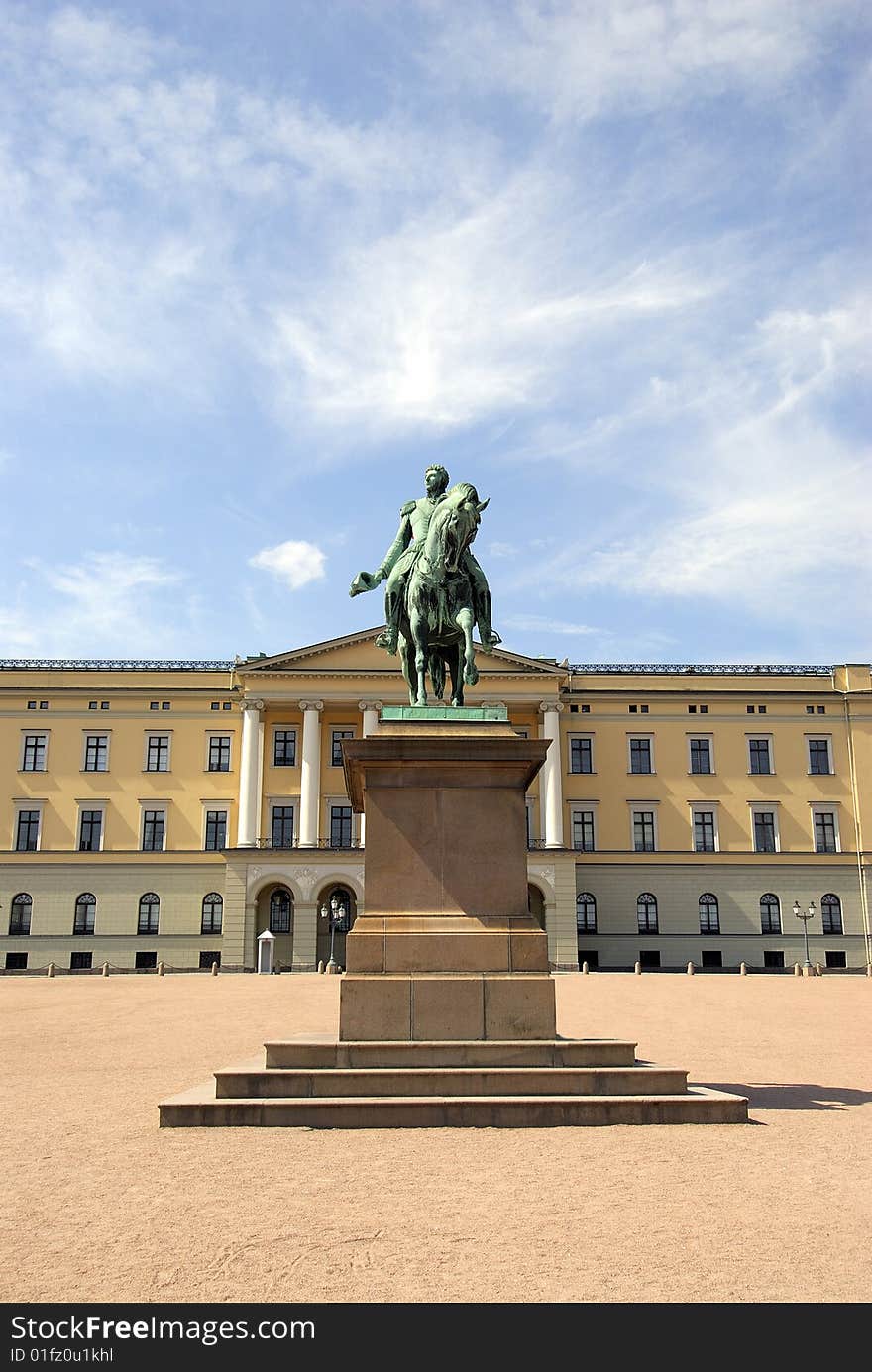 A statue by a palace