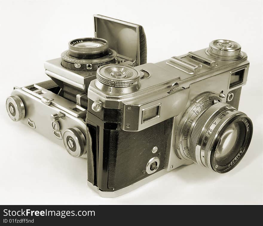 Two antiquarian 35-mm film cameras with put-forward lens. Two antiquarian 35-mm film cameras with put-forward lens.