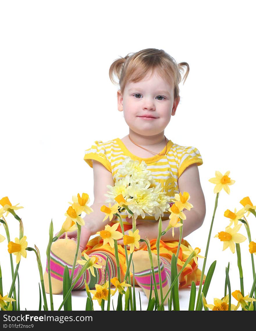 Funny little girl relaxing with yellow flowers. Funny little girl relaxing with yellow flowers