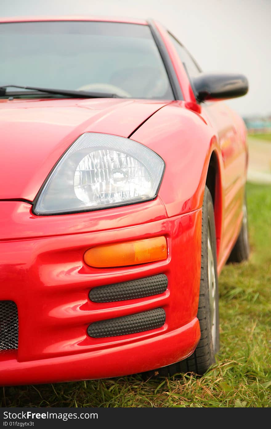 Red sport car. Close up.