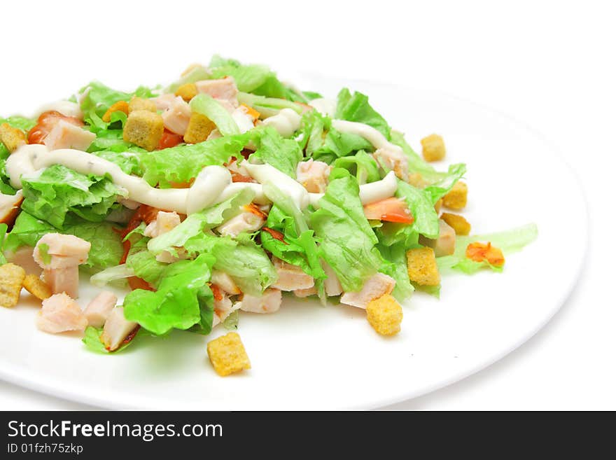 Caesar salad with chicken on white background