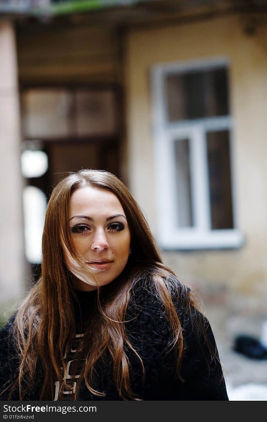 Stock photo: an image of a nice girl standing in the yard