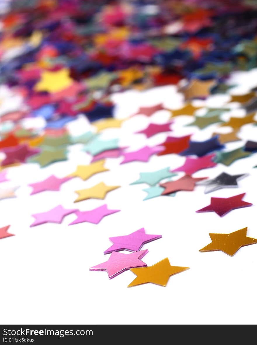 Stars in the form of confetti on white