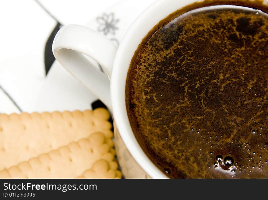 Cup of black coffe with cake