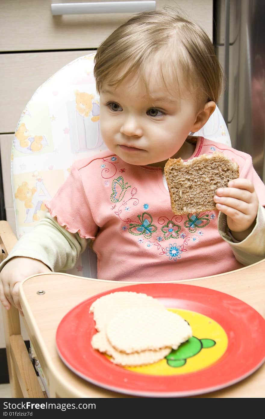 Sweet toddler baby girl eating. Sweet toddler baby girl eating