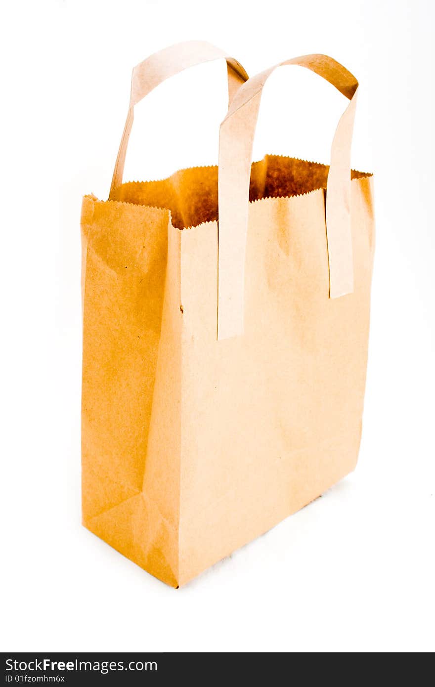 A single empty paper bag isolated on white. A single empty paper bag isolated on white