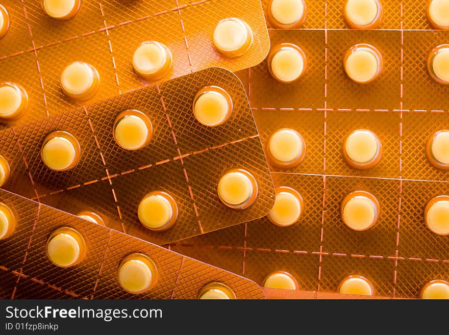 Stock photo: health theme: an image of orange pills closeup