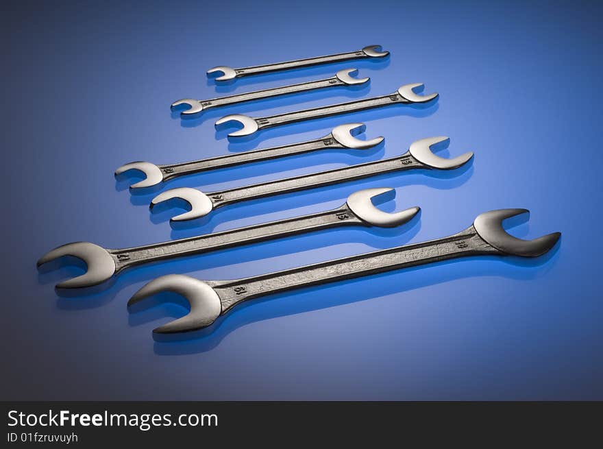 Chrome tool set on blue background. Chrome tool set on blue background.