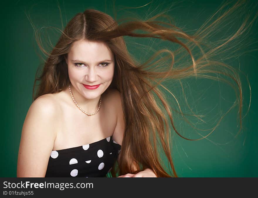 Beautiful woman with waving long red hair