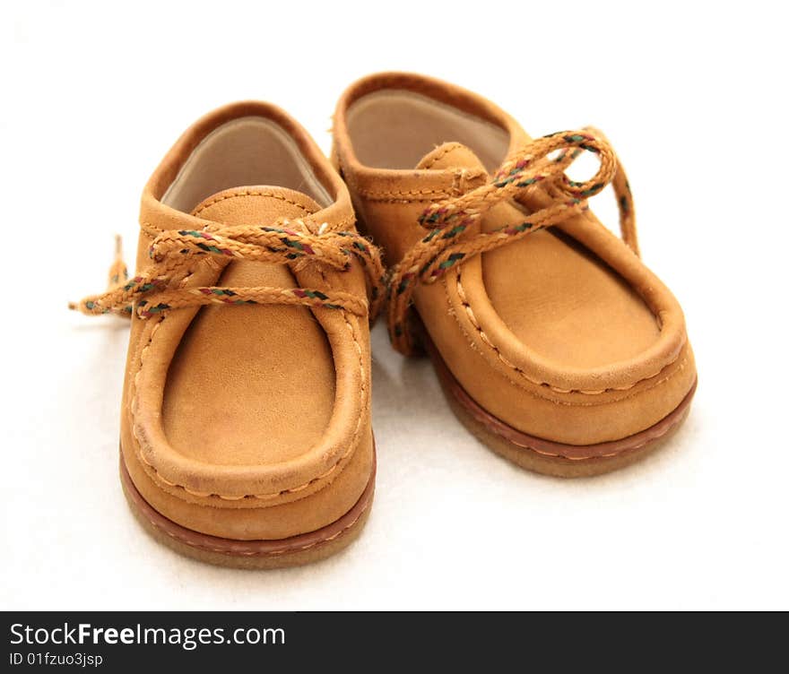 Baby shoes on white background