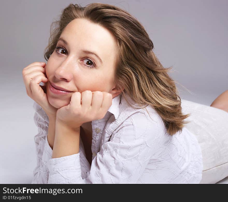 Smiling woman on gray background