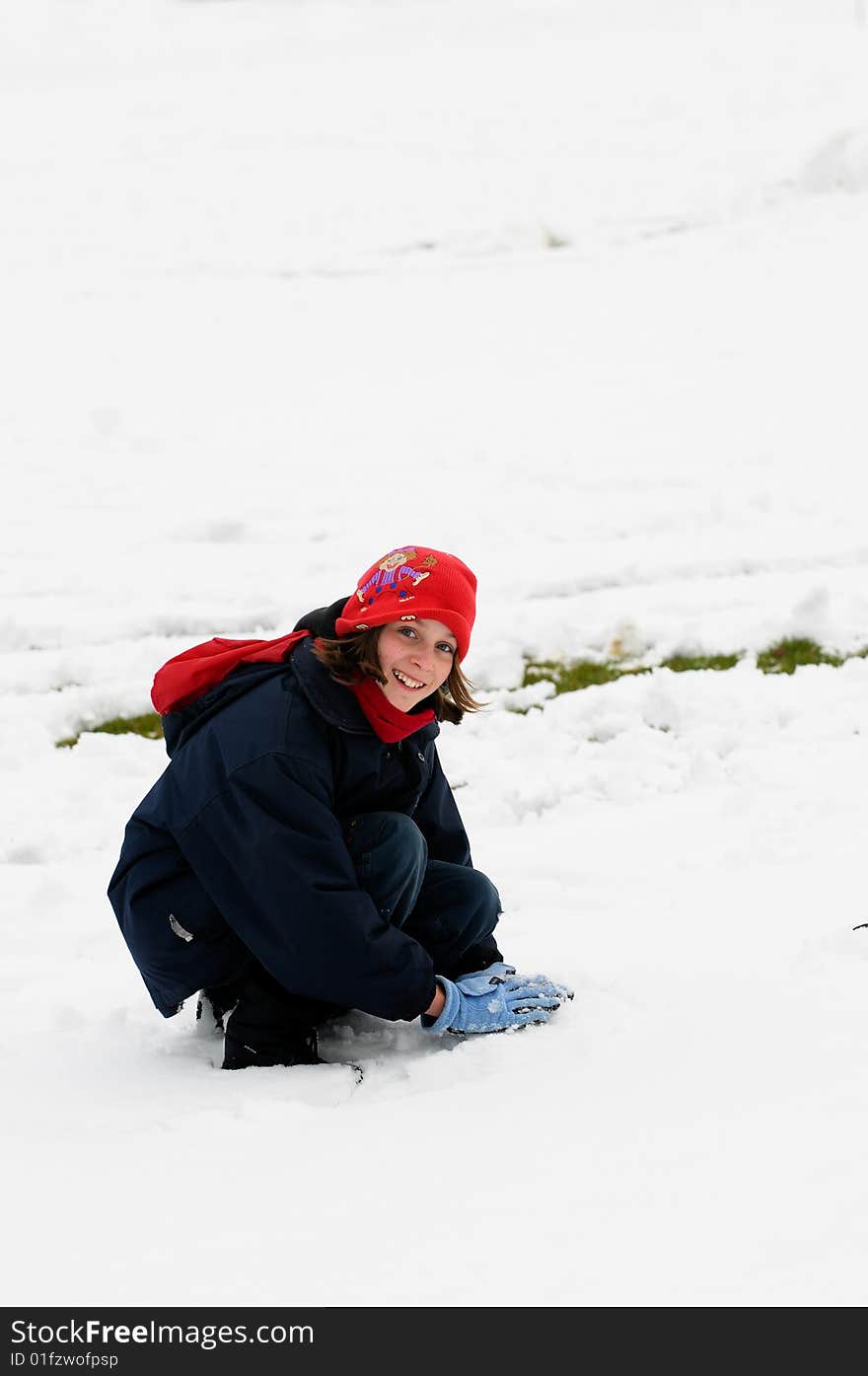 Portrait of girl playing in the snow