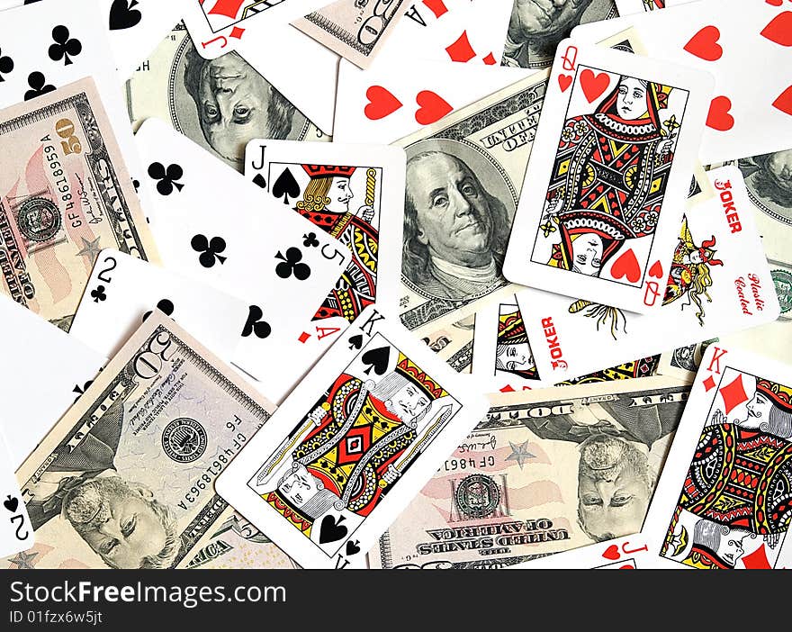 Playing cards and American dollars as a background. Playing cards and American dollars as a background