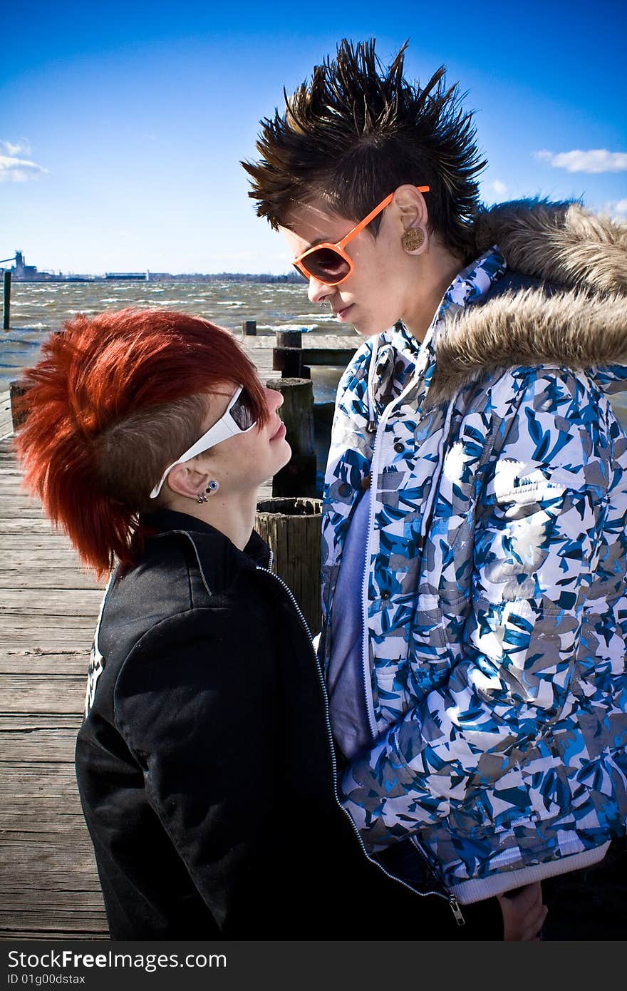 Two young women sharing an intimate moment by the river