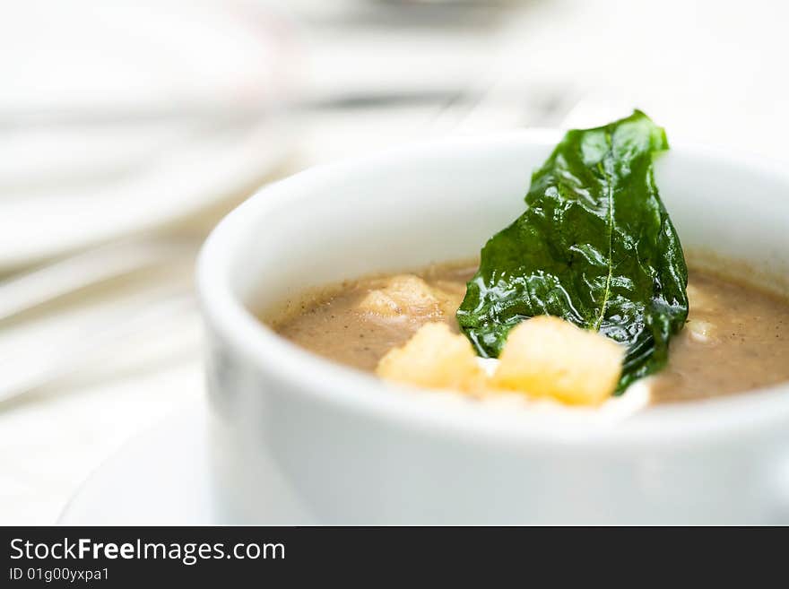 A bowl of creamy soup before the main course. A bowl of creamy soup before the main course