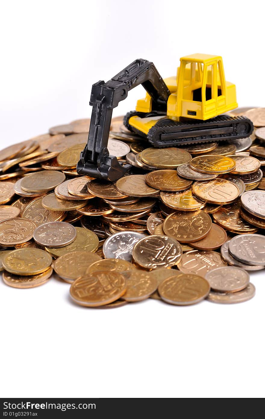 Yellow excavator on a big heap of coins