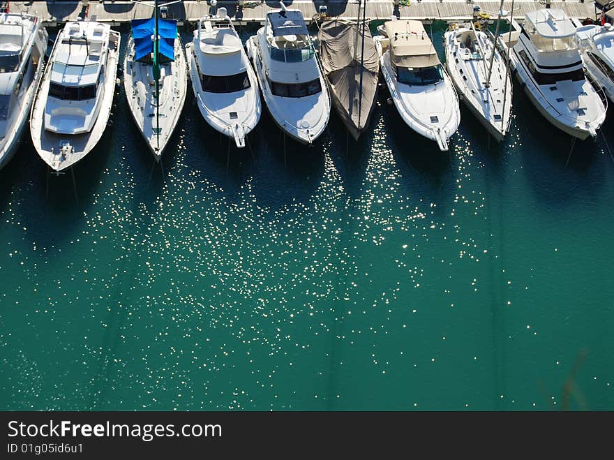 Boats in a harbour at the sunset. Boats in a harbour at the sunset.