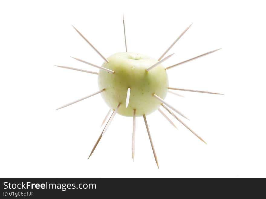 The isolated apple covered with thorns