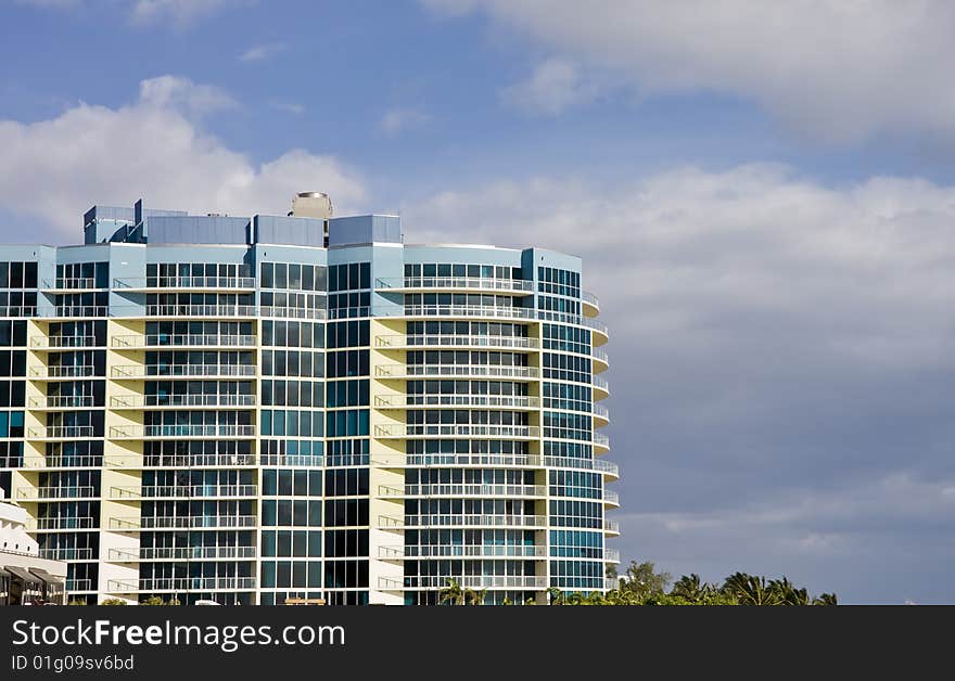 A blue and white hotel on the coast