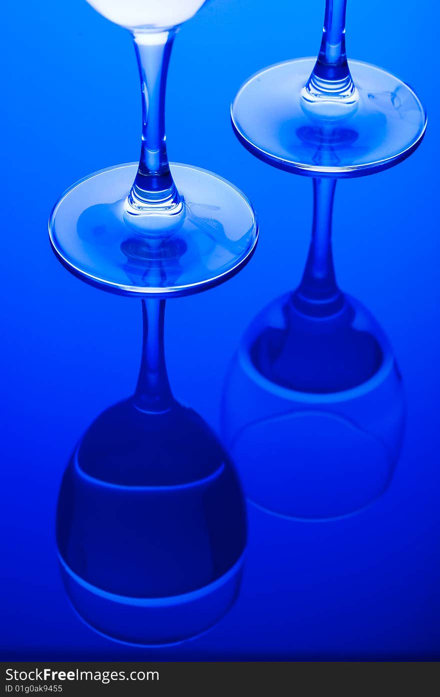 Blue Glass with Splashing water. Coolness Drink