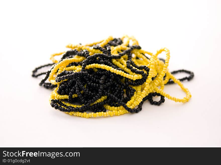 Wreathed black and yellow beads dressed in a thread