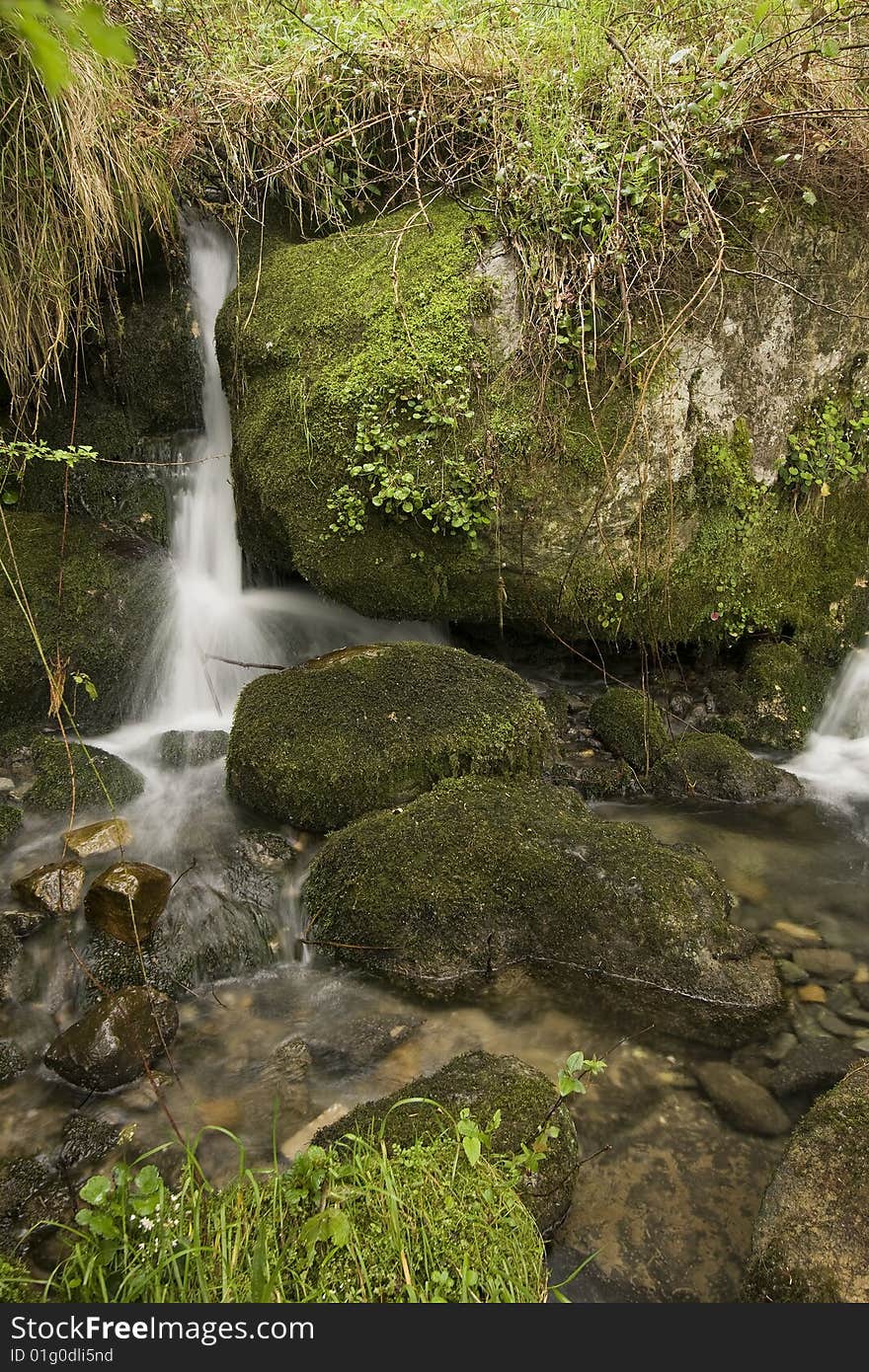 The beautiful waterfall in the forest, autumn (long exposure)