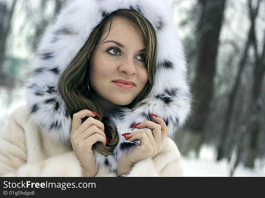 Beautiful lady in fur in the winter