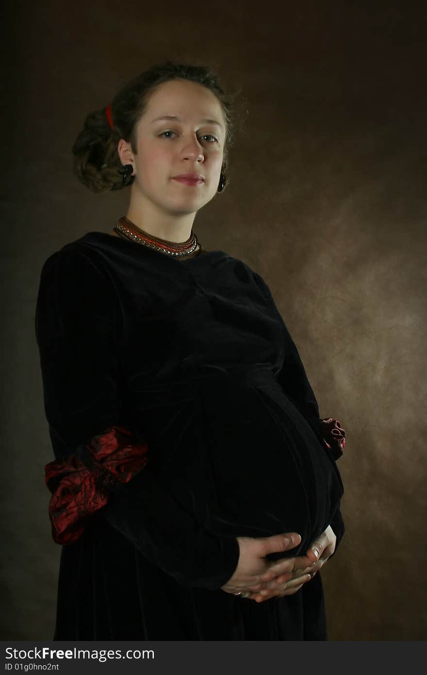 Pregnant Woman With In A Velvet Dress