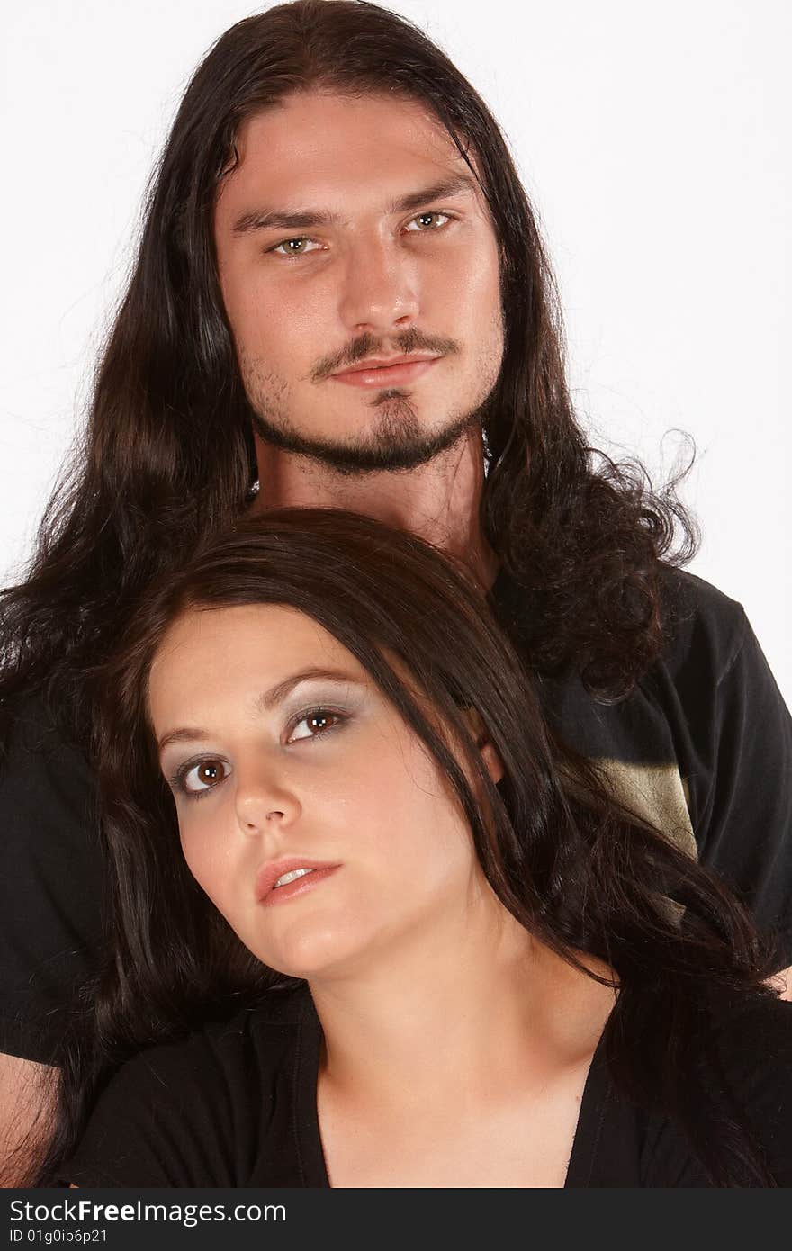 Two young lovers both with dark long hair. Two young lovers both with dark long hair