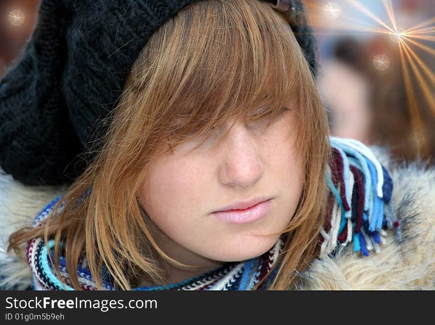 The young girl with the black hat looked wistfully. The young girl with the black hat looked wistfully.