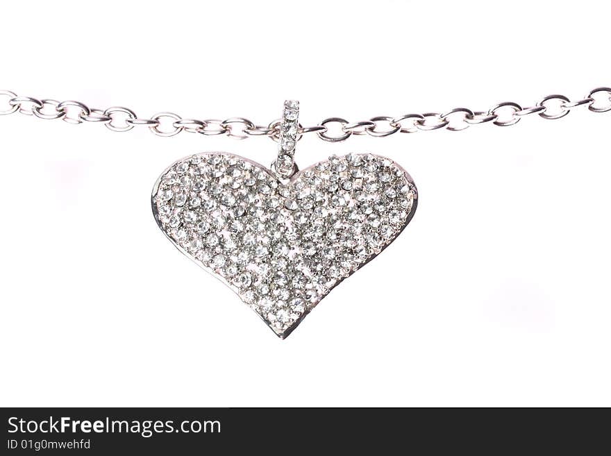 A silver heart on a white background