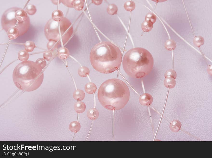 Pink perls on a white background