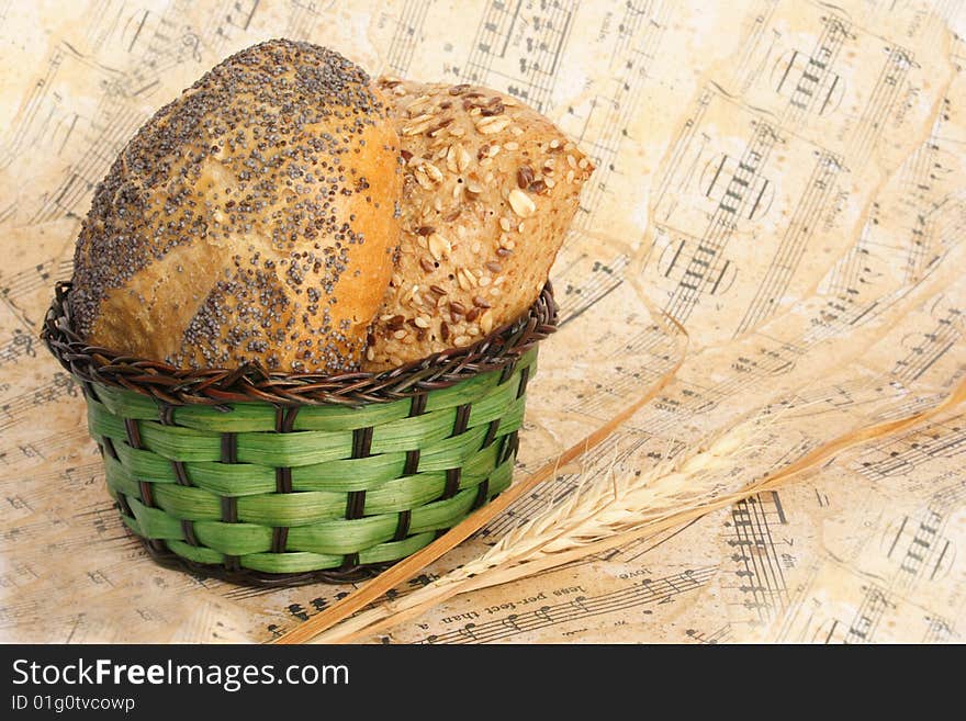 Bread and wheat as a giving on music sheet. Bread and wheat as a giving on music sheet