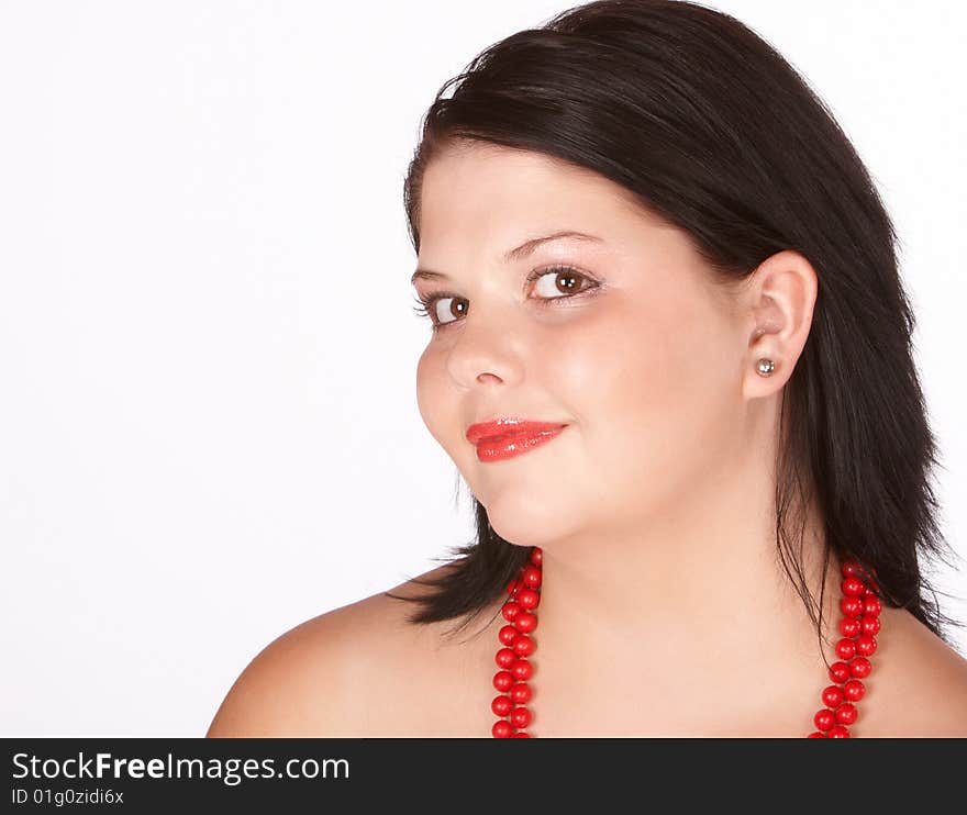 Young female with bright red lips and red necklace of beads. Young female with bright red lips and red necklace of beads