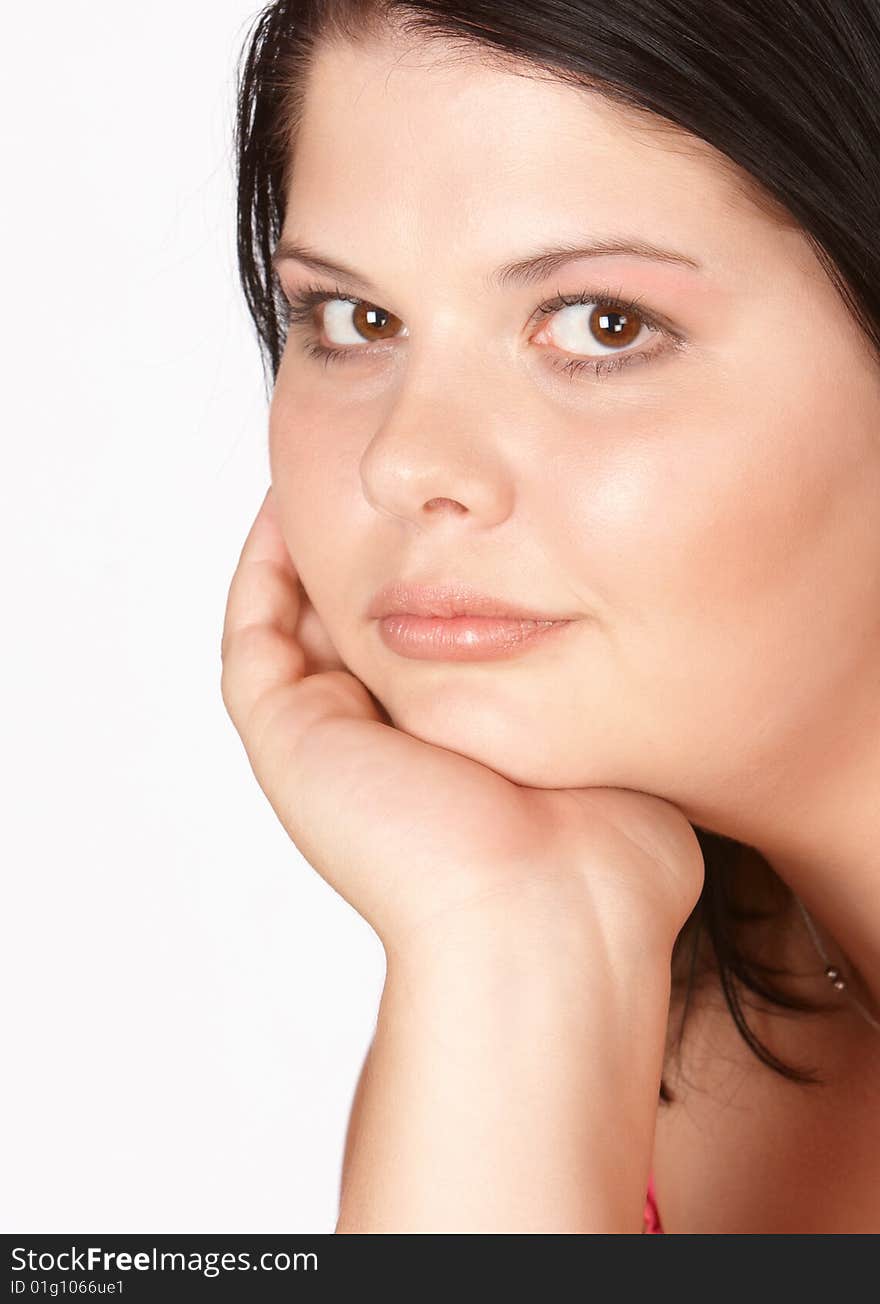 Young female with head in hands thinking hard