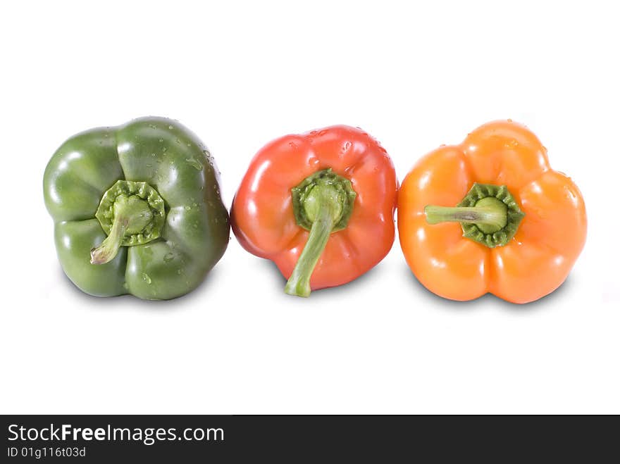 Three colored paprika in row