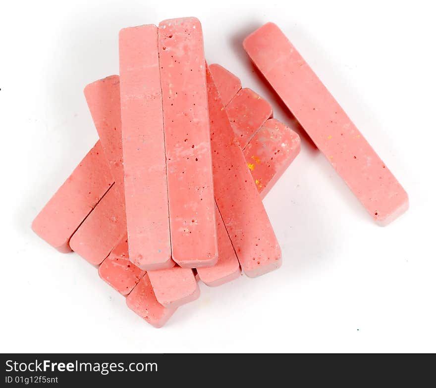 Stacked group red chalk on white background