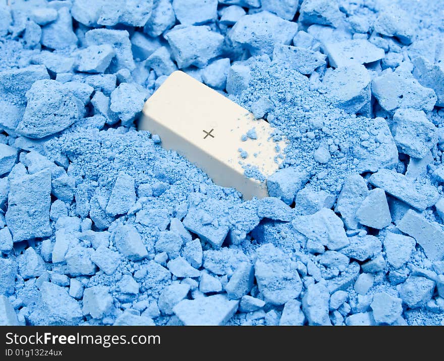 Keyboard button Plus in blue crushed chalk. Keyboard button Plus in blue crushed chalk