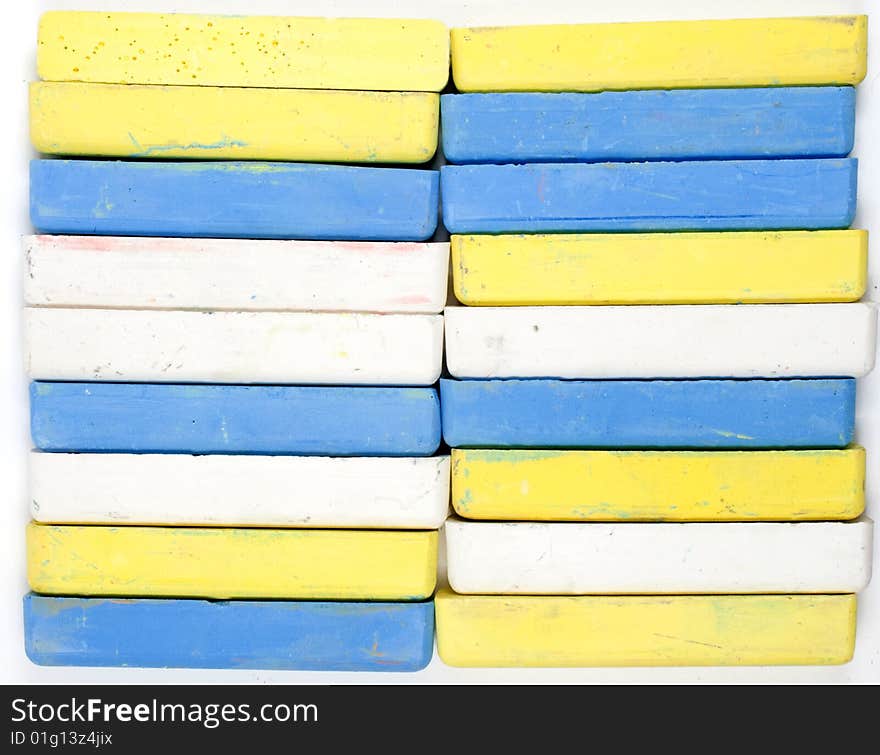 Two vertical rows of colored chalks, background. Two vertical rows of colored chalks, background