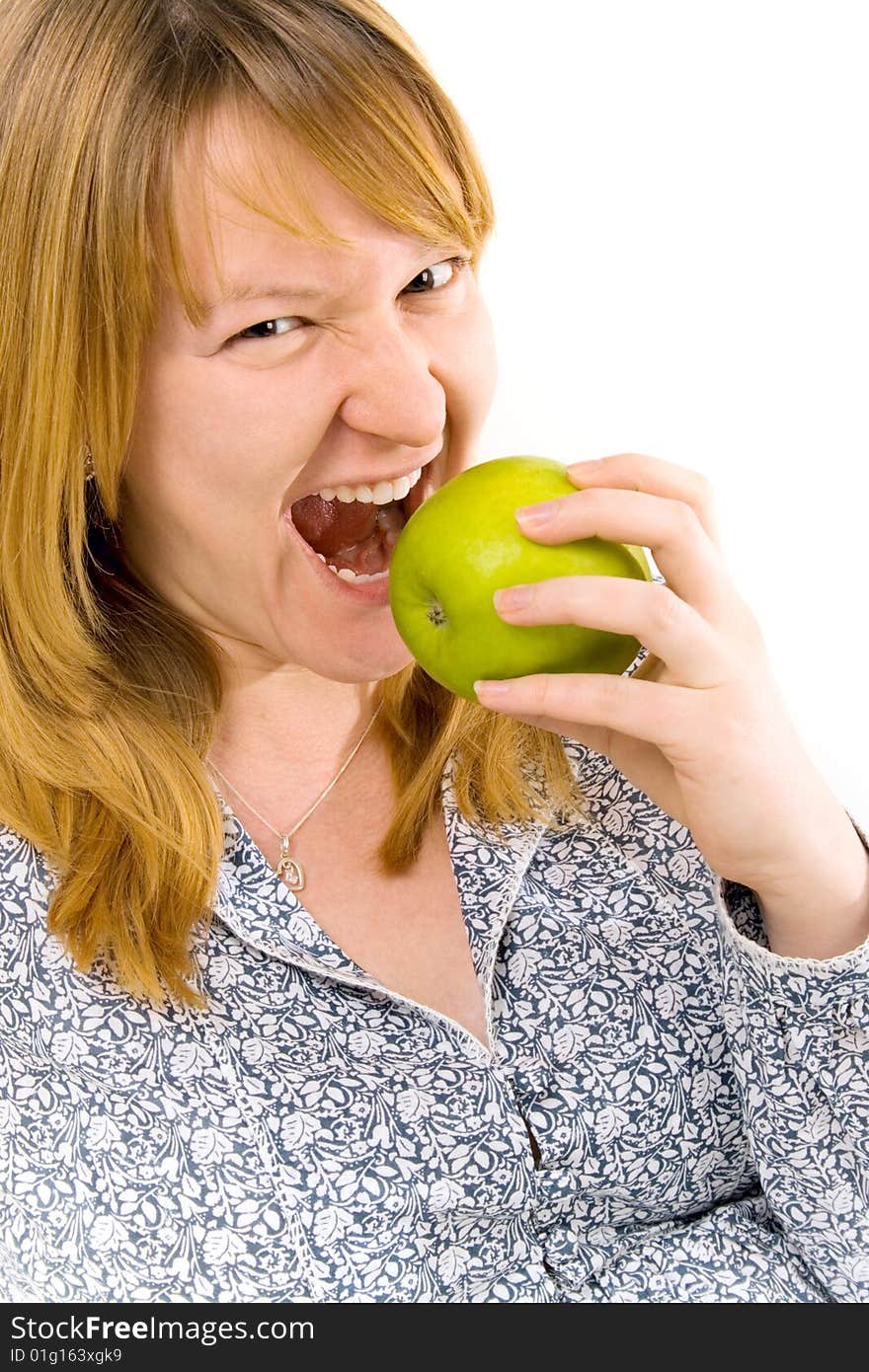 Young woman eating apple over white background