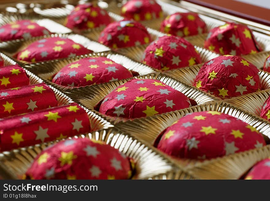 Sweets wrapped up by a foil in brilliant packing