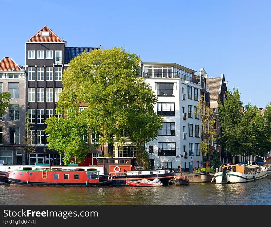 A number of the old houses which are standing along channels in Amsterdam. A number of the old houses which are standing along channels in Amsterdam