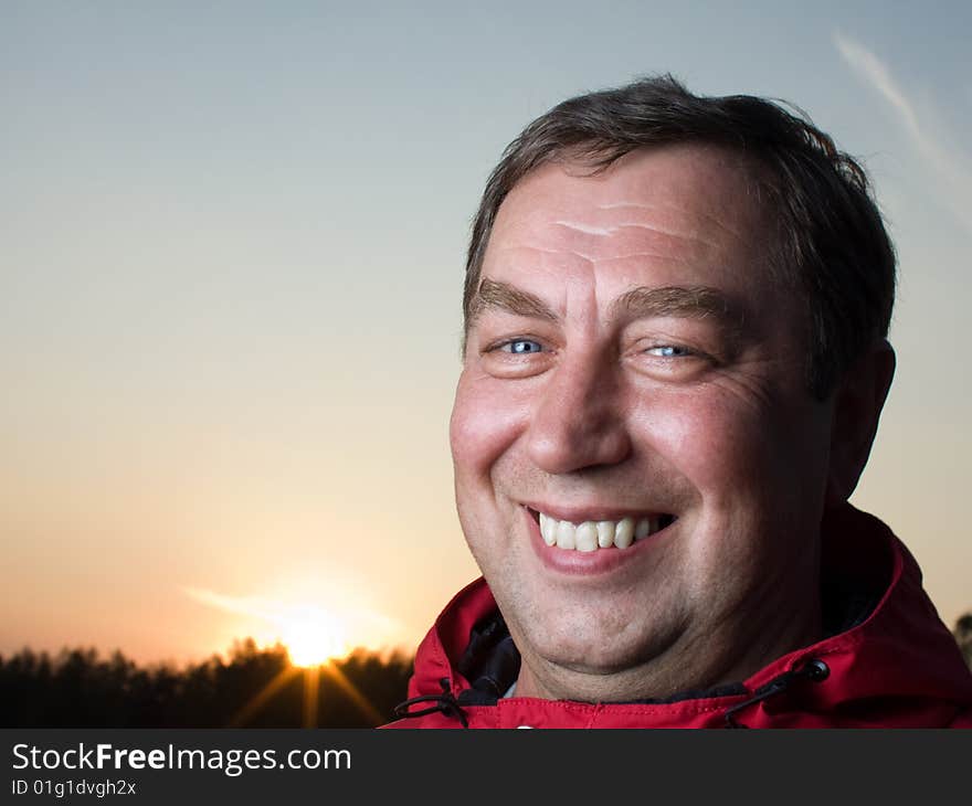 Portrait of a man outdoors against the sun