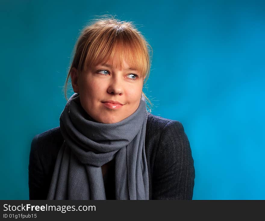 Portrait of female on a blue background in studio