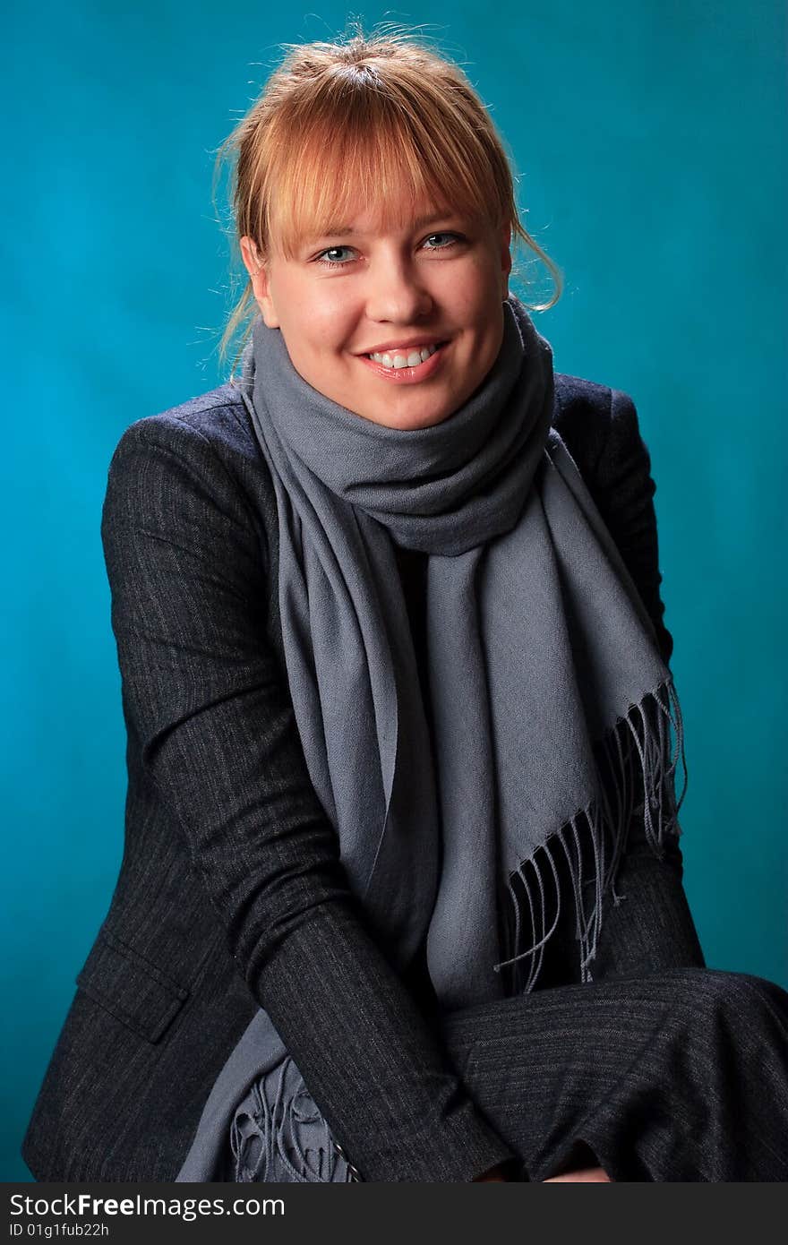 Portrait of female on a blue background in studio