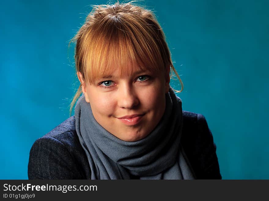 Portrait of female on a blue background in studio